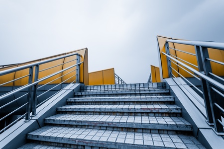 Stairs leading up to a bright sky and clouds.の写真素材