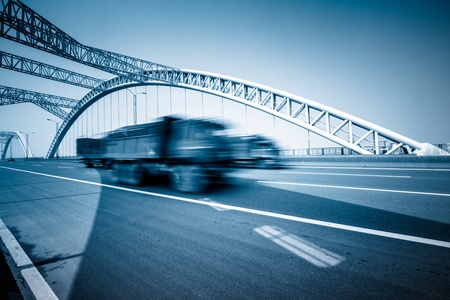rushing truck go through the bridgeの写真素材