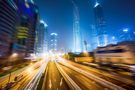 the light trails on the modern building background in shanghai china.の写真素材