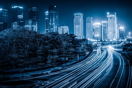 the light trails on the modern building background in shanghai china.の写真素材