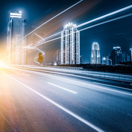 the light trails on the modern building background in shanghai china.の写真素材