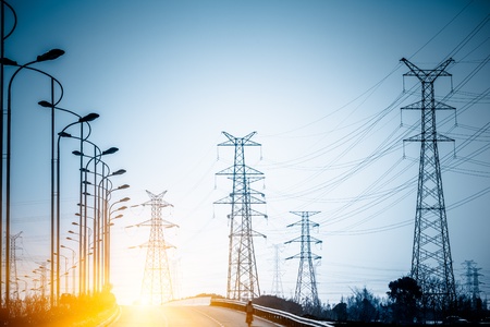 road to the High voltage towers at sunset.の写真素材