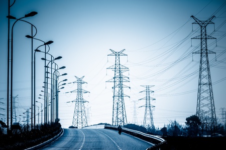 road to the High voltage towers at sunset.の写真素材