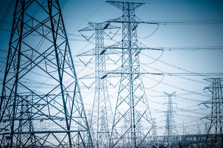 High voltage towers with sky background. blue toned images.