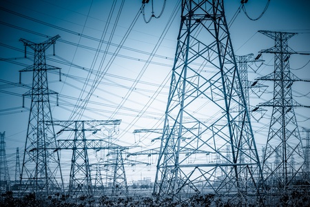 High voltage towers with sky background. blue toned images.の写真素材