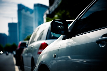 cars at parking lot of city outdoor.