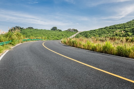 clean freeway go through the county field by day.の写真素材