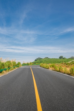 clean freeway go through the county field by day.の写真素材