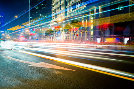 Car light trails and urban landscape in shanghaiの写真素材