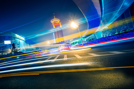 the light trails on the modern building background in shanghai china.の写真素材