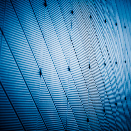 Close up glass building detail in shanghai,china.blue toned image.の写真素材