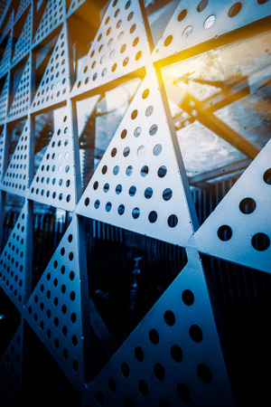 close up of modern building wall pattern,blue toned image.の写真素材