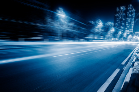 blurred traffic in the daowntown center,chongqing china,blue toned image.の写真素材