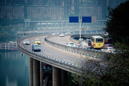 traffic on highway,with city skyline background,chongqing china.