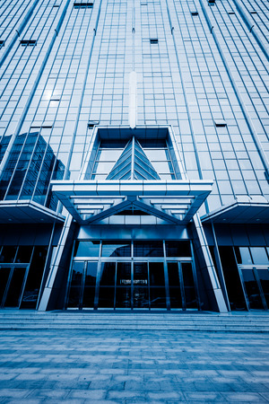 low angle view of office block exterior,shanghai china,blue toned image.のeditorial素材