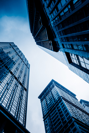 low angle view of skyscrapers of chongqing city,china,blue toned image.の写真素材