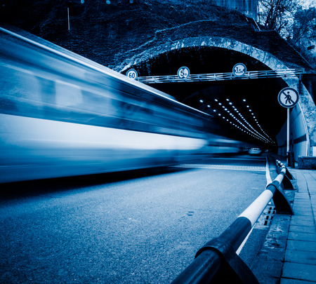 traffic in tunnel,chongqing china,blue toned image.の写真素材