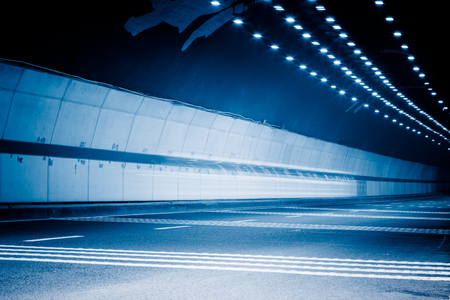 traffic in tunnel,chongqing china,blue toned image.の写真素材