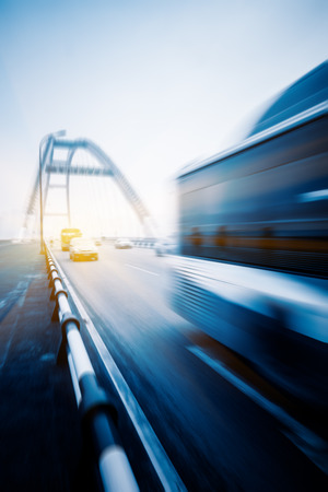 motion blurred traffic on bridge,chongqing china.の写真素材