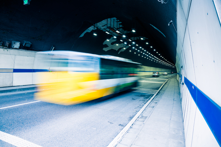traffic in tunnel,chongqing china,blue toned image.の写真素材