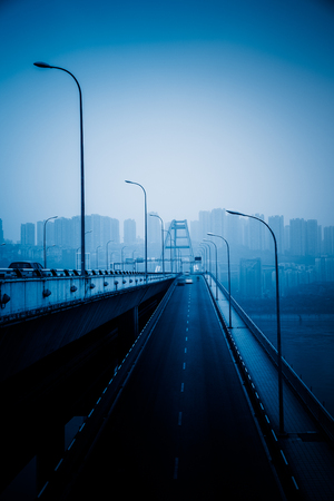 motion blurred traffic on bridge,chongqing china.の写真素材