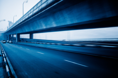 motion blurred traffic on bridge,chongqing china.の写真素材