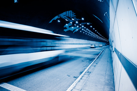 traffic in tunnel,chongqing china,blue toned image.の写真素材