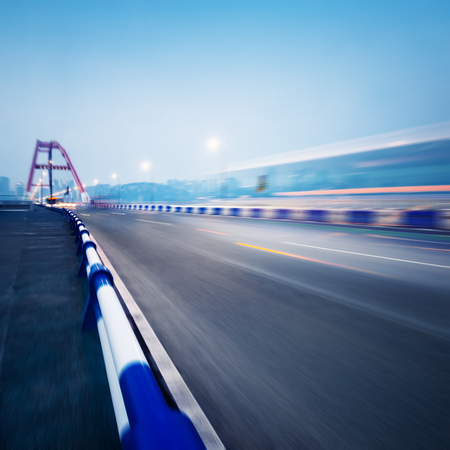 traffic trails at caiyuanba yangtze river bridge,chongqing china.の写真素材