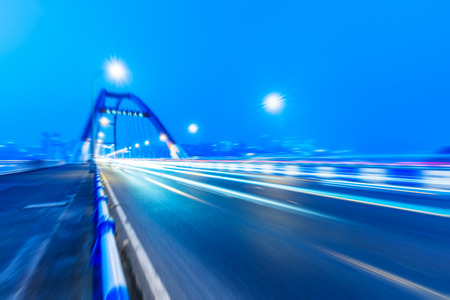 traffic trails at caiyuanba yangtze river bridge,chongqing china.の写真素材