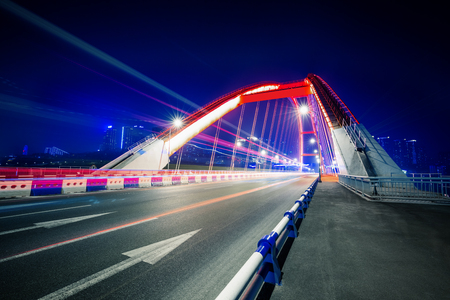 traffic trails at caiyuanba yangtze river bridge,chongqing china.の写真素材