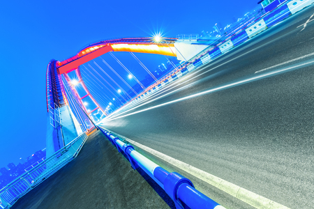 traffic trails at caiyuanba yangtze river bridge,chongqing china.の写真素材