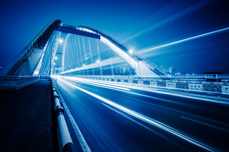 traffic trails at caiyuanba yangtze river bridge,chongqing china.の写真素材