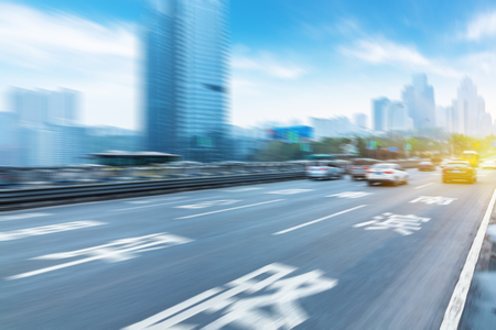traffic on highway,with city background,chongqingの写真素材