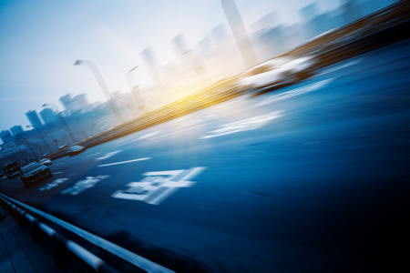 traffic on highway,with city background,chongqingの写真素材
