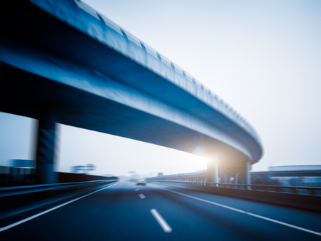 car driving on the highway,blue toned.の写真素材