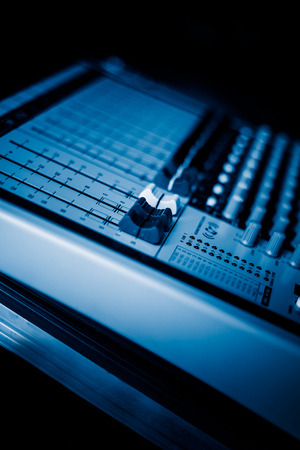 close-up view of professional sound mixer,blue toned,still life.の写真素材