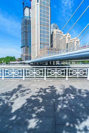 empty cement floor with modern architecture backgroundの写真素材