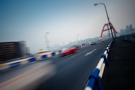 motion blurred traffic on bridge,chongqing china.の写真素材