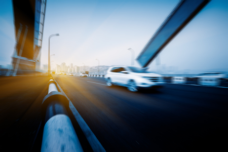 motion blurred traffic on bridge,chongqing china.の写真素材