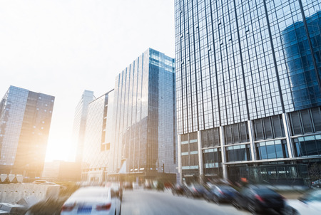 modern buildings against sunsetの写真素材