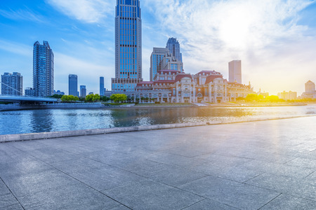 empty tiled floor and urban skyline,tianjin china.の写真素材