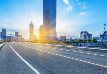 modern buildings with empty road under blue sky,tianjin china.の写真素材