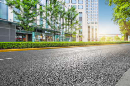 clean asphalt road with city skyline background,china.の写真素材