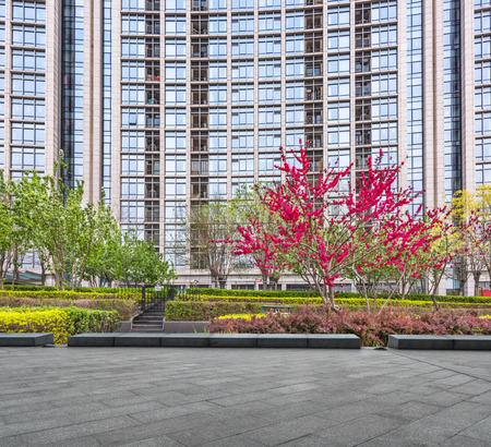 pavement front of financial building with greenのeditorial素材