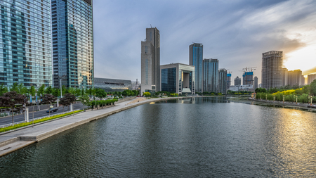 Modern buildings and river in urban city,tianjin chinaのeditorial素材