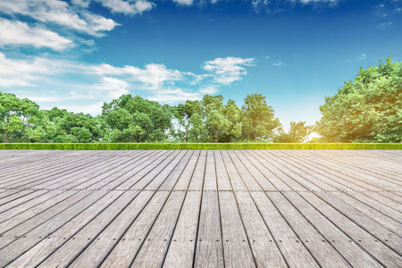 empty wooden floor with modern building in cityの写真素材
