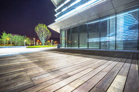 Empty wooden footpath front modern buildingのeditorial素材