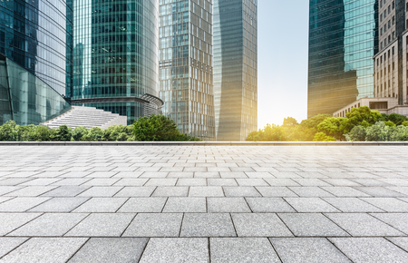 empty pavement front of modern architectureの写真素材