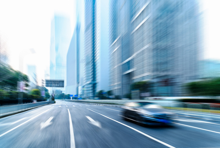 cars driving on inner city road of shanghai,china,asia.の写真素材
