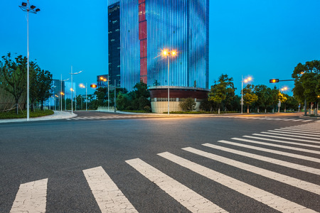 clean asphalt road through office block area,suzhou,china.のeditorial素材